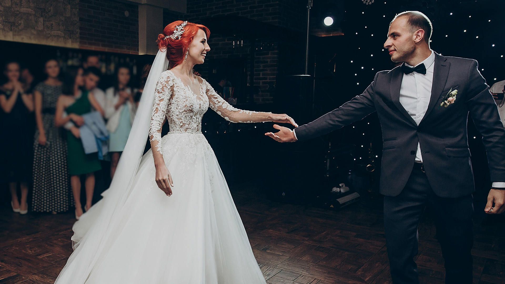 Bride and groom joining on the dance floor for the first dance