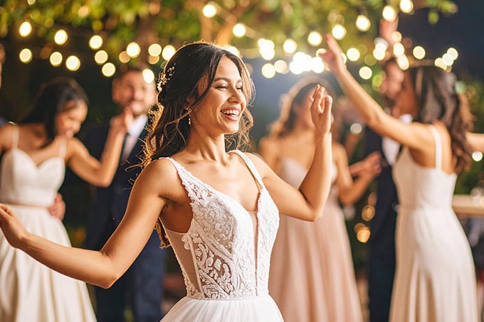 Bridesmaids dance at outdoor wedding